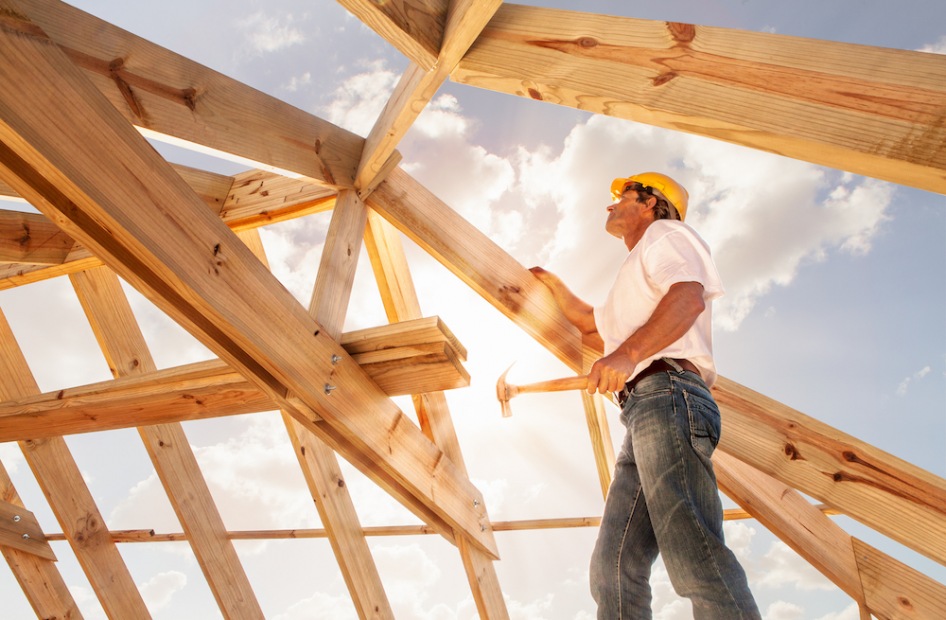 Contstruction Construction worker looking at the roof
